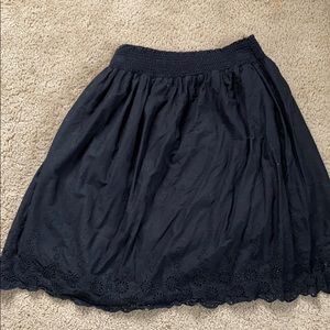 Classic black skirt with lace detail on bottom